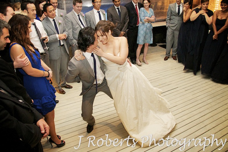 Bride leaning into groom while dancing - wedding photography sydney